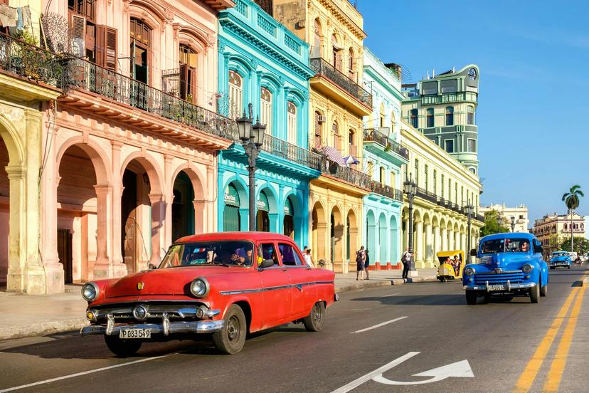 HAVANA,CUBA - MAY 26,2016 : Street scene with old cars and colorful buildings in Old Havana