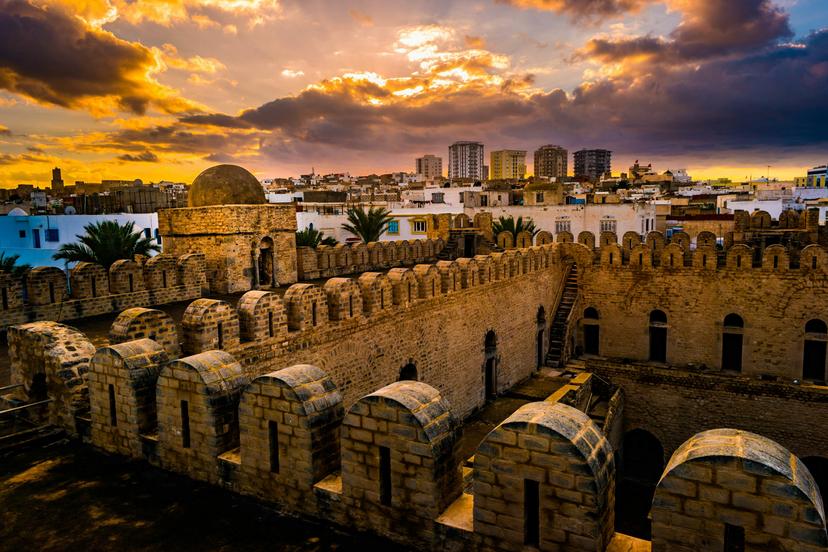 The fortress walls of the Ribat of Sousse during sunset.