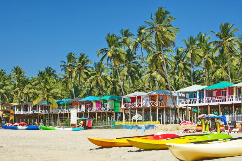 Palolem beach Southern Goa, India colorful sea front bungalows landscape
