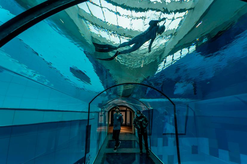 A diver is seen in the deepest pool in the world with 45.5-metre (150-foot) located in Mszczonow about 50 km from Warsaw, November 21, 2020. - The complex, named Deepspot, even includes a small wreck for scuba and free divers to explore. It has 8,000 cubic metres of water -- more than 20 times the amount in an ordinary 25-metre pool. (Photo by Wojtek RADWANSKI / AFP) (Photo by WOJTEK RADWANSKI/AFP via Getty Images)