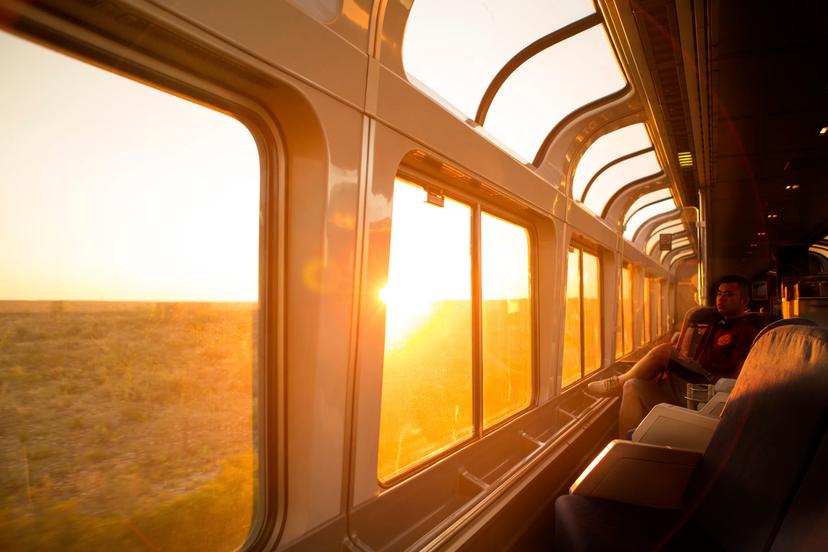A young man watches the sun rise over Texas on the Amtrack train travelling from San Antonio to Alpine.