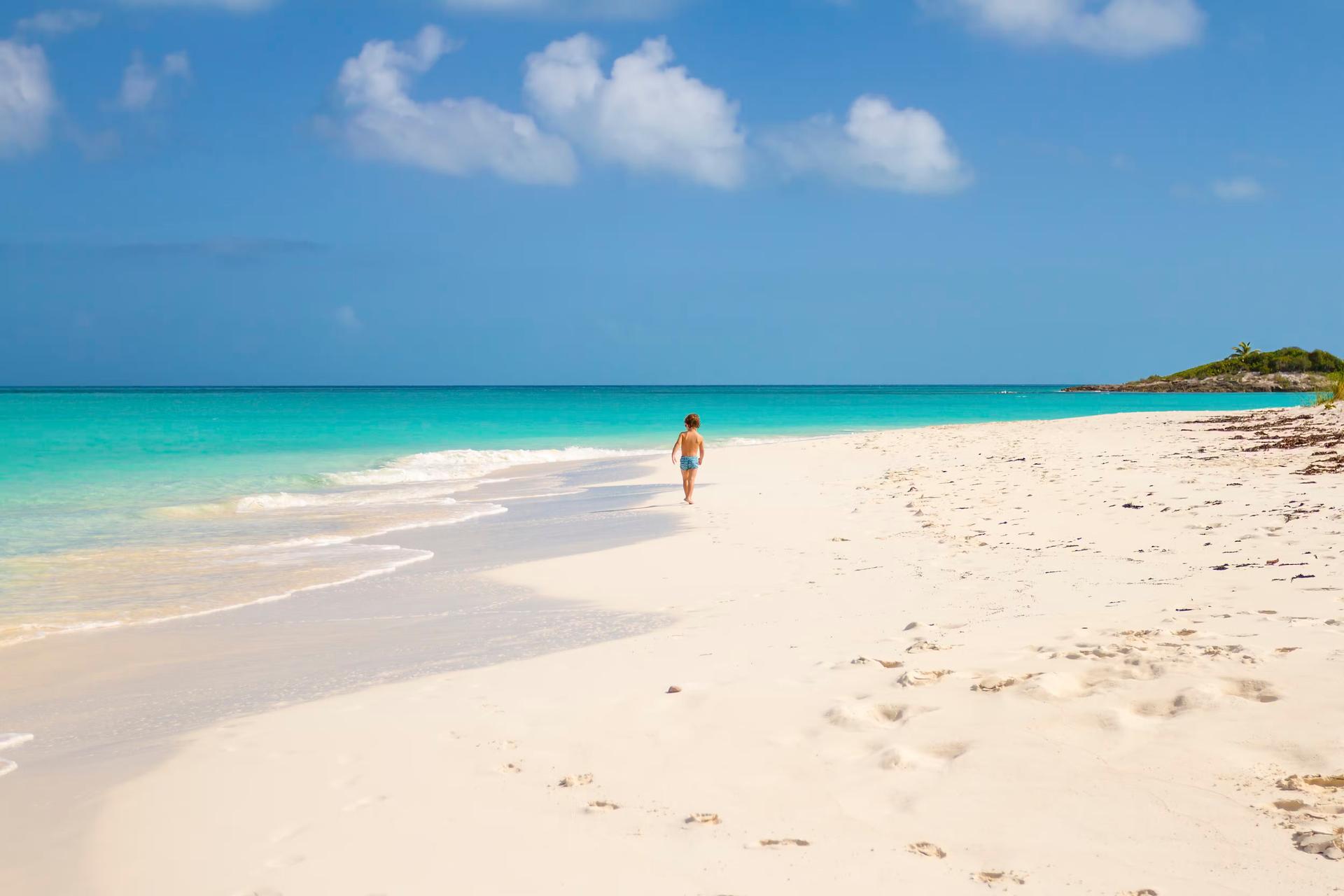 Child running in Tropic of Cancer Beach - Bahamas