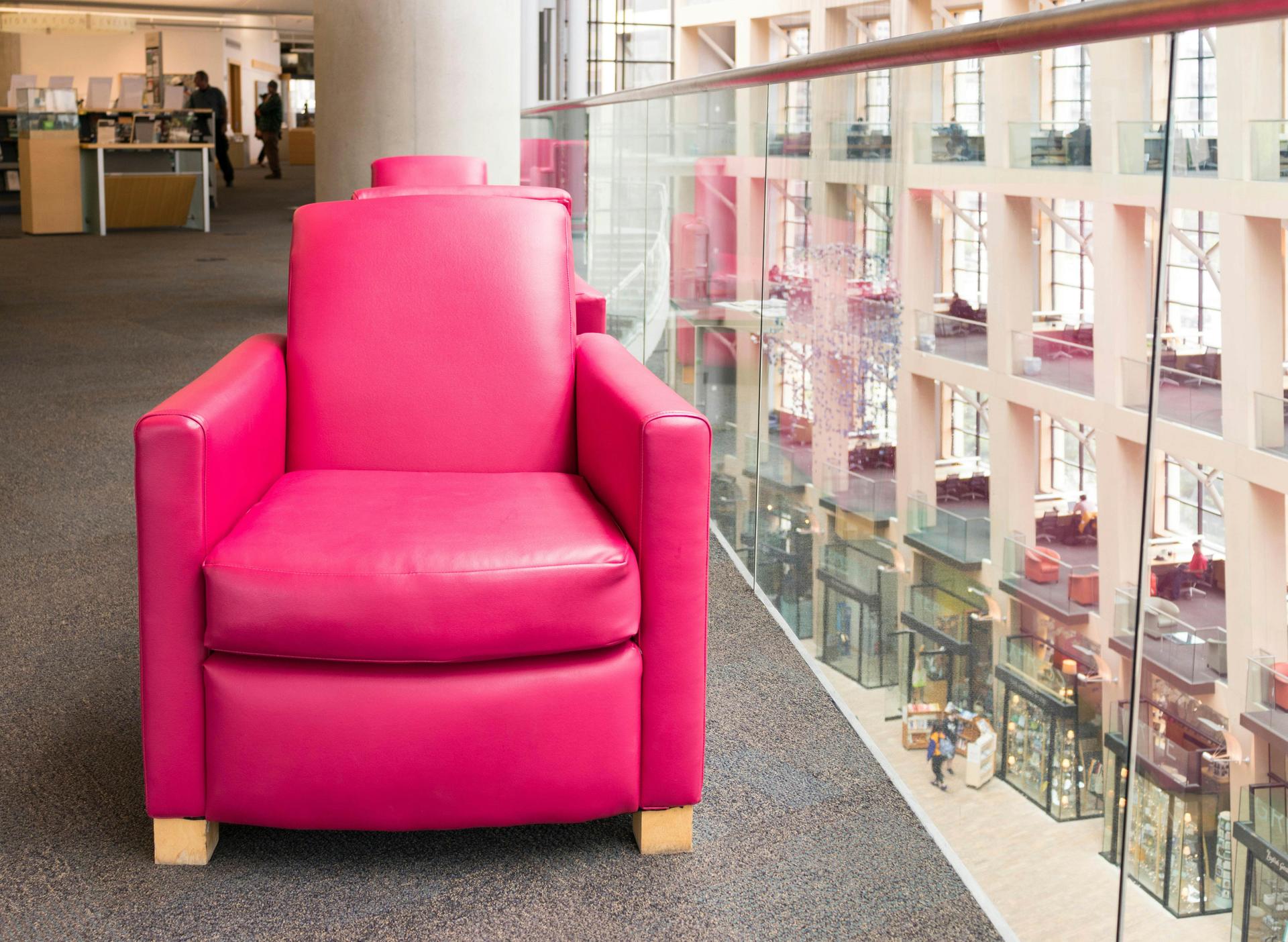 Salt Lake City, Utah, USA - May 2, 2018: Pink Leather Chair inside Salt Lake City Public Library, Utah.