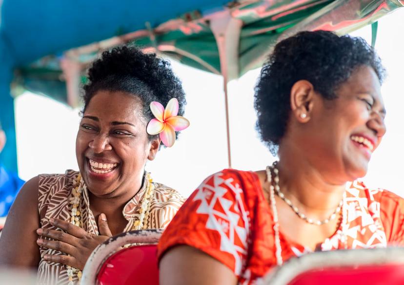 Fijian ladies riding on bus.
