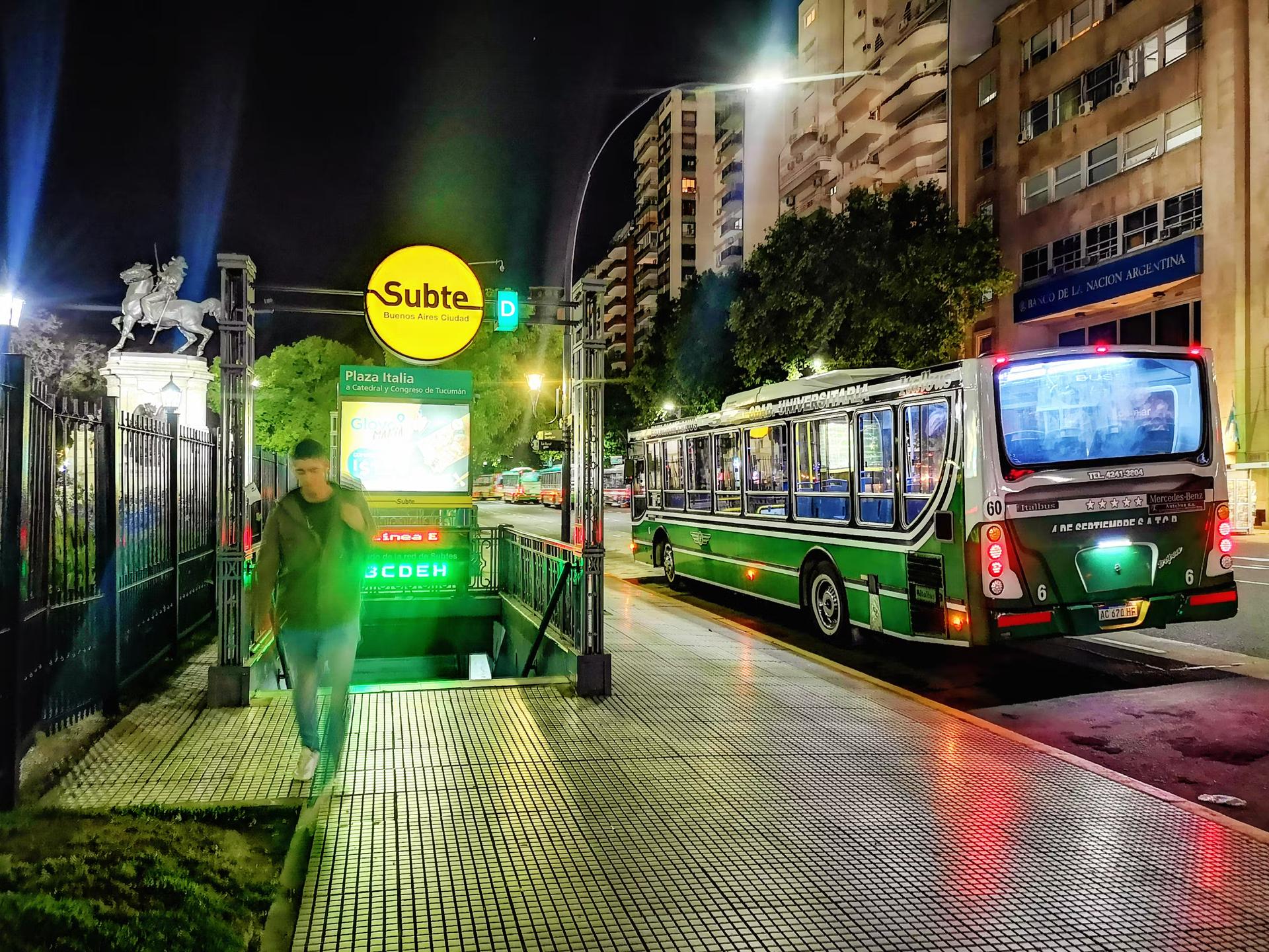 A bus and subway station in Buenos Aires at night