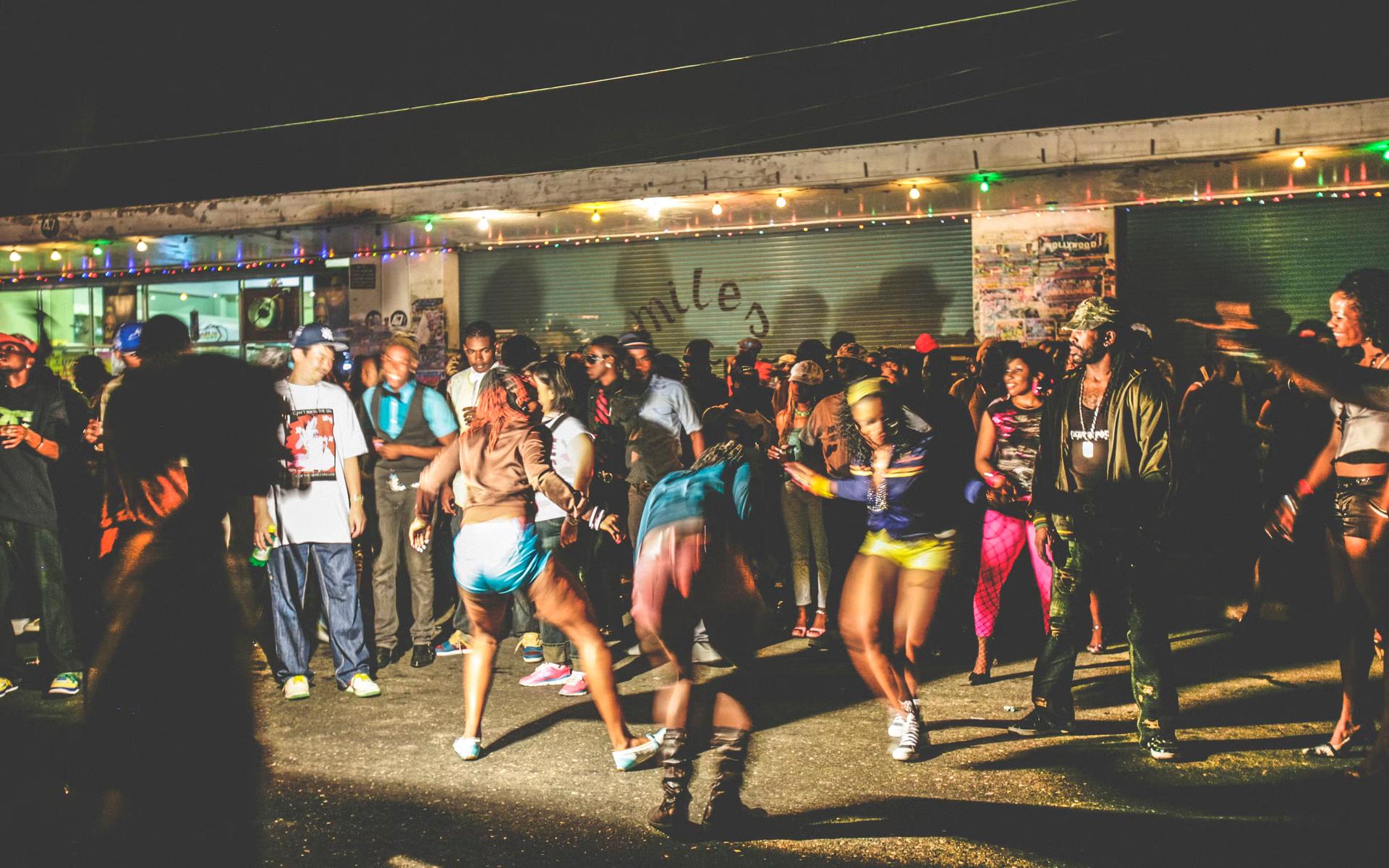 A crowd enjoying reggae/dancehall music at a street party in Tivoli Gardens, Kingston, Jamaica, Caribbean