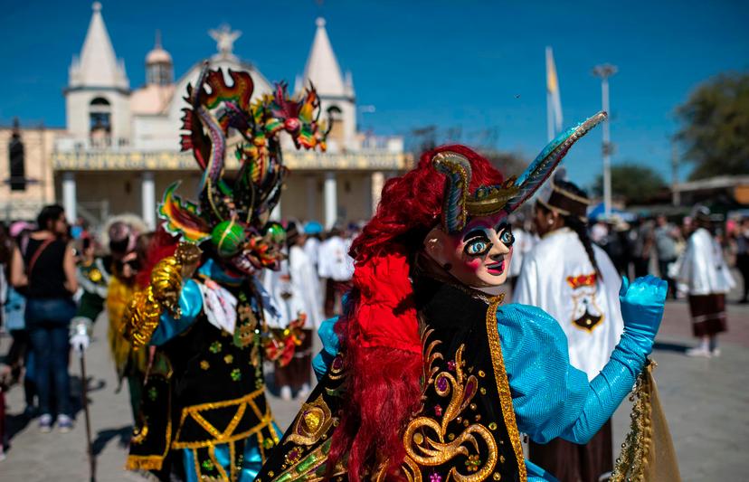 Dancers in traditional costumes perform during "La Tirana" religious carnival, in the streets of La Tirana, 78 km east of Iquique, northern Chile, on July 15, 2019. - The celebration, an Andean festivity related to mining workers and farmers in honour of the Virgin of Carmel, is the largest religious holiday in northern Chile. (Photo by Martin BERNETTI / AFP)        (Photo credit should read MARTIN BERNETTI/AFP via Getty Images)
