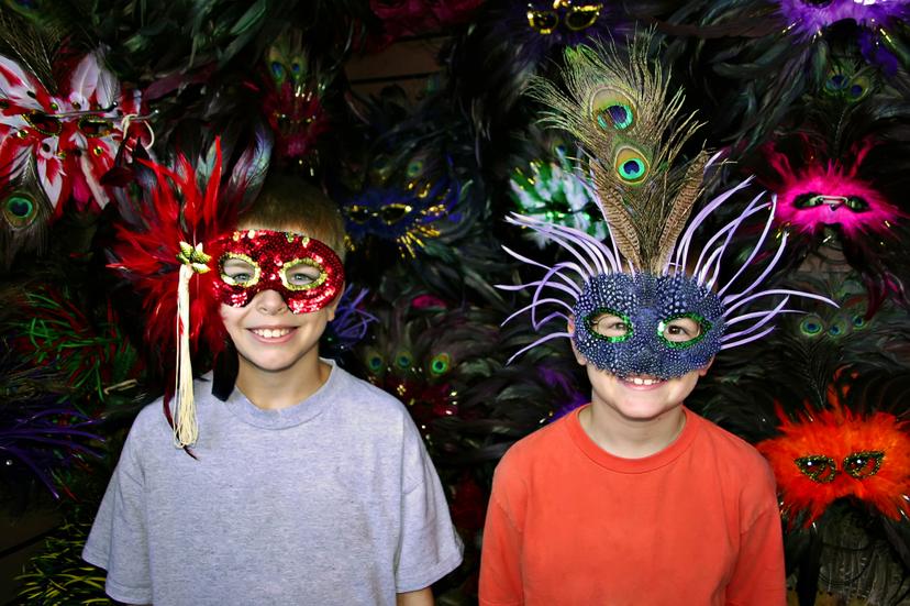 Brothers try on masks in New Orleans, Louisiana.