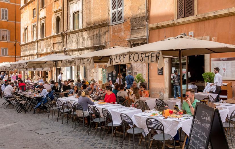 APRIL 30, 2018: Diners outside a restaurant in the Jewish Ghetto quarter of Rome.