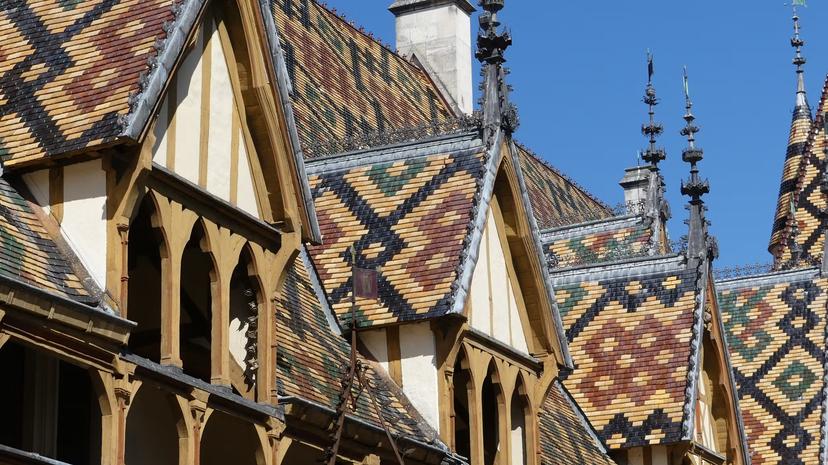 Hospices de Beaune or Hotel-Dieu de Beaune is a former charitable almshouse in Beaune, France. Courtyard, internal facade with polychrome roof