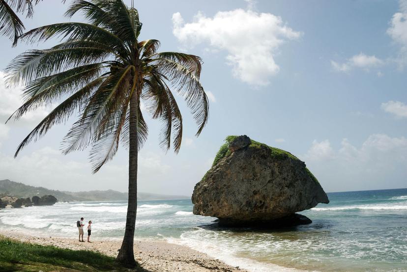 BWRYFM Two sightseers on coast at Bathsheba, Barbados, West Indies, Caribbean.