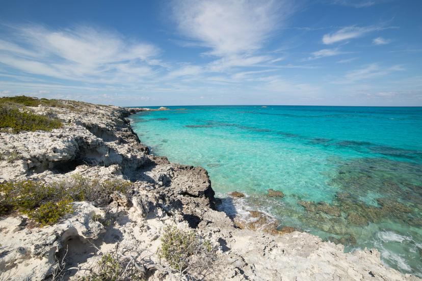 Warderick Wells, Exuma Cays Land and Sea Park, Bahamas - sparkling clear waters from a cliffside hiking trail in the Bahamas National Trust Park; Shutterstock ID 705378439; your: Sloane Tucker; gl: 65050; netsuite: Online Editorial; full: Bahamas Hikes Article