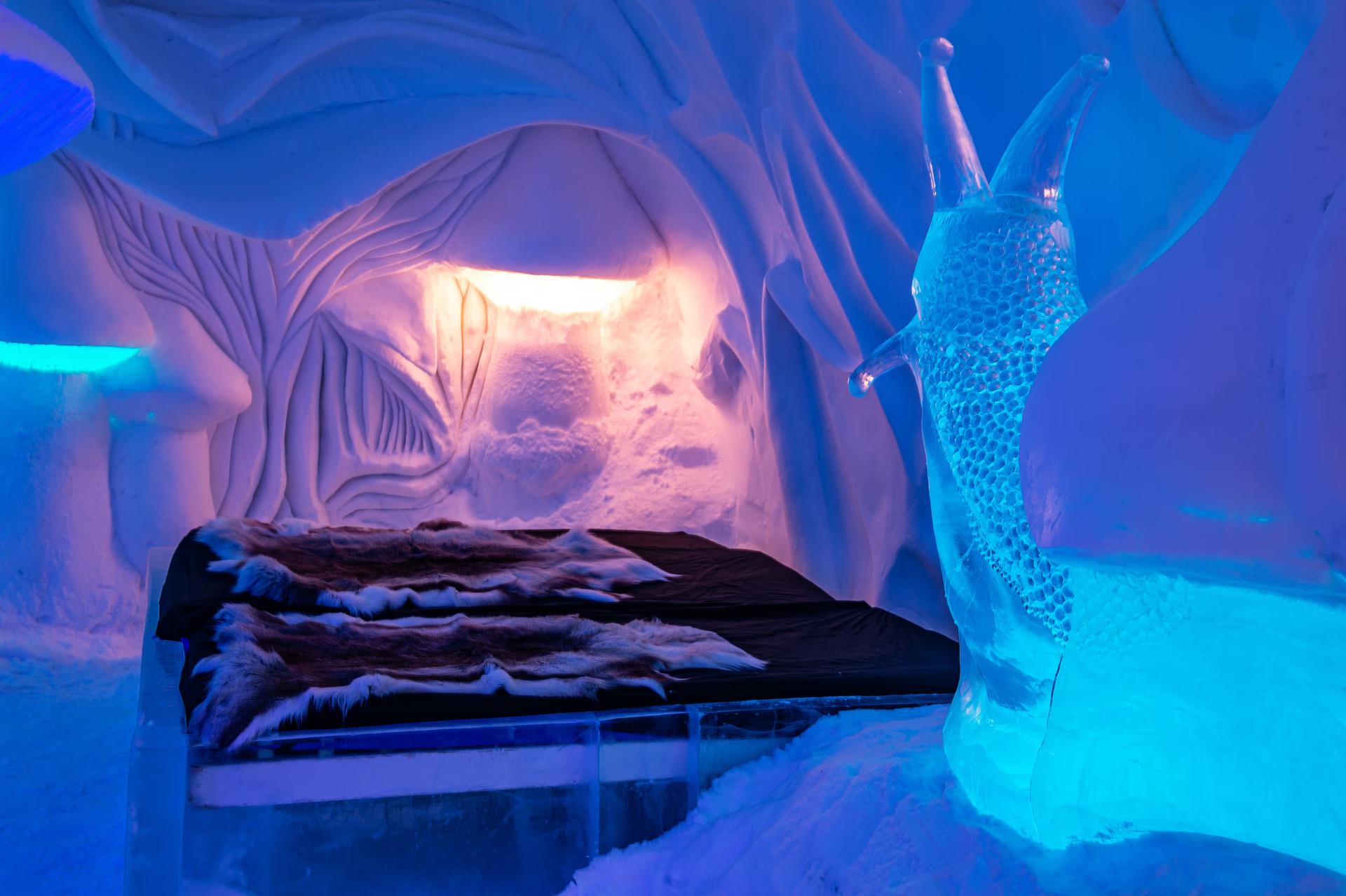 An ice room inside of an Icehotel.
