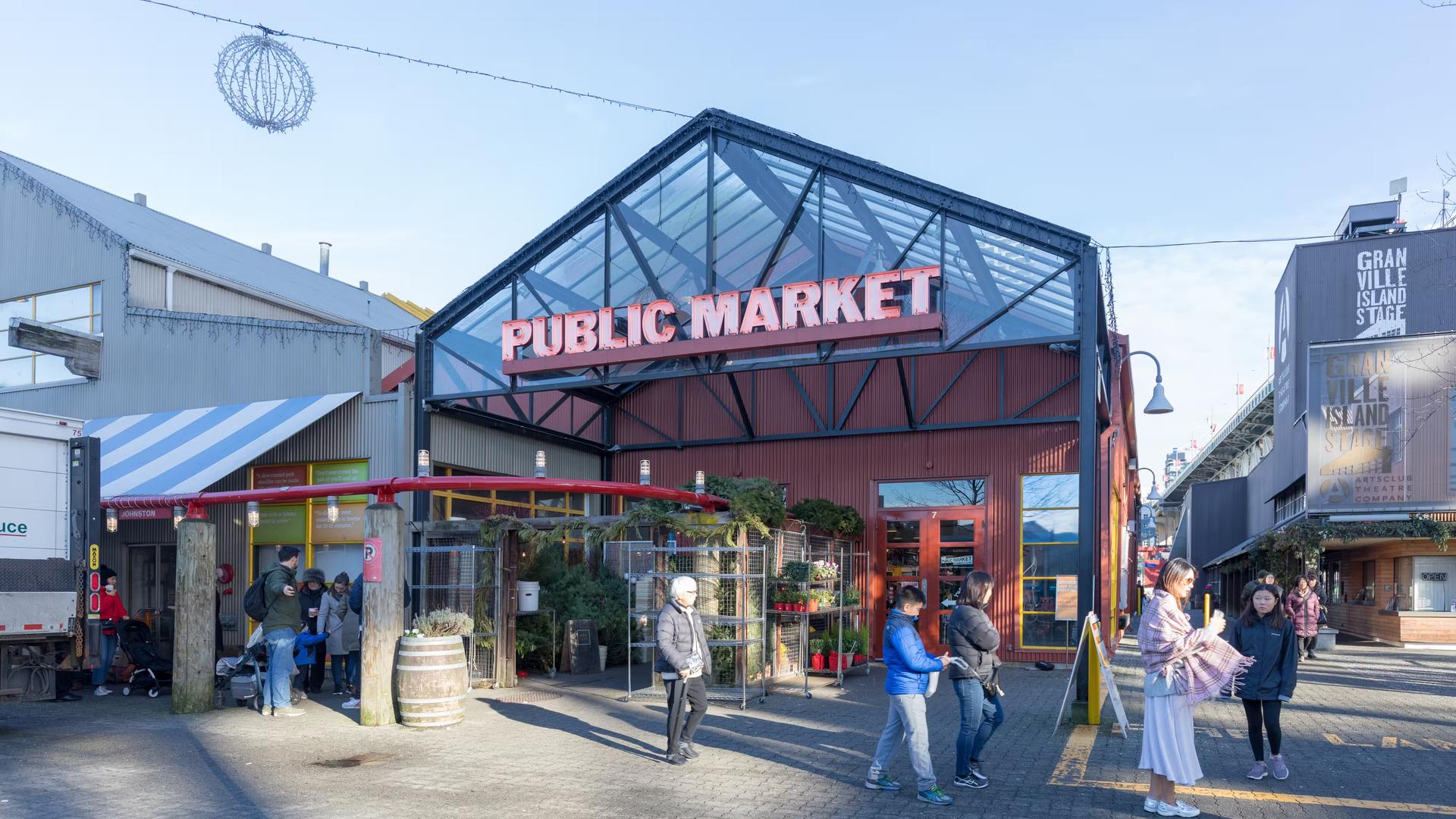 The exterior of Granville Island Public Market in Vancouver, home to over 100 vendors offering fresh seafood, meats, sweets and European specialty foods.