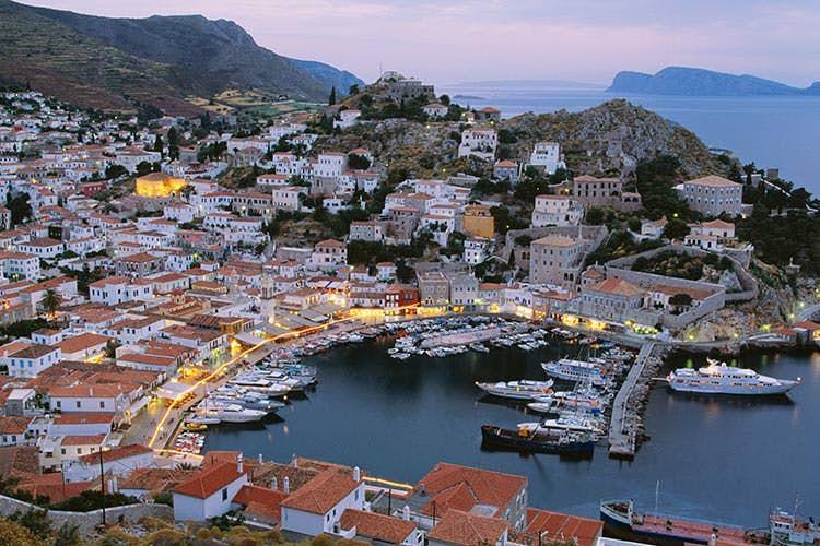 The harbor of Hydra at dusk. Image by Shaun Egan / Photodisc / Getty Images