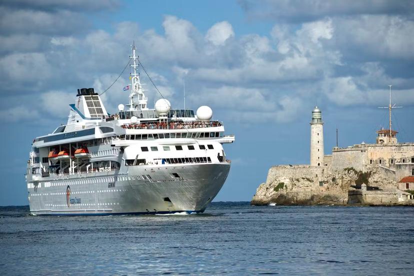 Cruiseship entering Havana Harbour as it passes Morro Castle and lighthouse