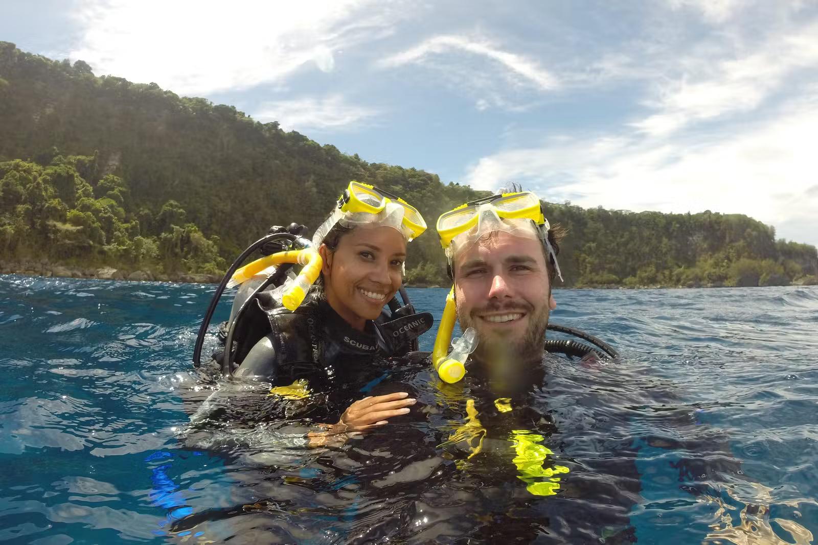 Kia and Peter from Atlas and Boots take a selfie in the sea while diving © Atlas and Boots