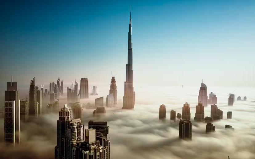 Dubai Downtown Skyline in early morning fog, United Arab Emirates