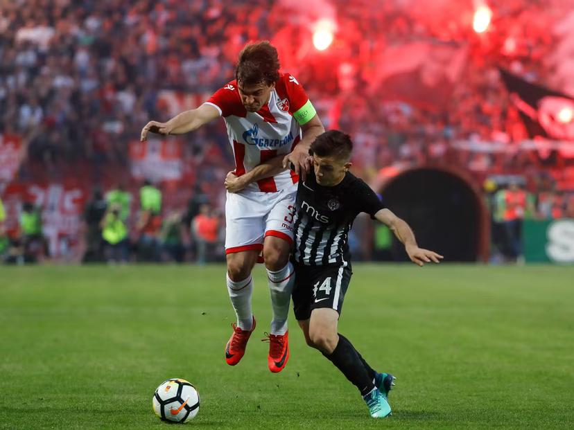 Red Star and Partizan players battle in a Serbian Super League match at Marakana stadium © Srdjan Stevanovic / Getty Images