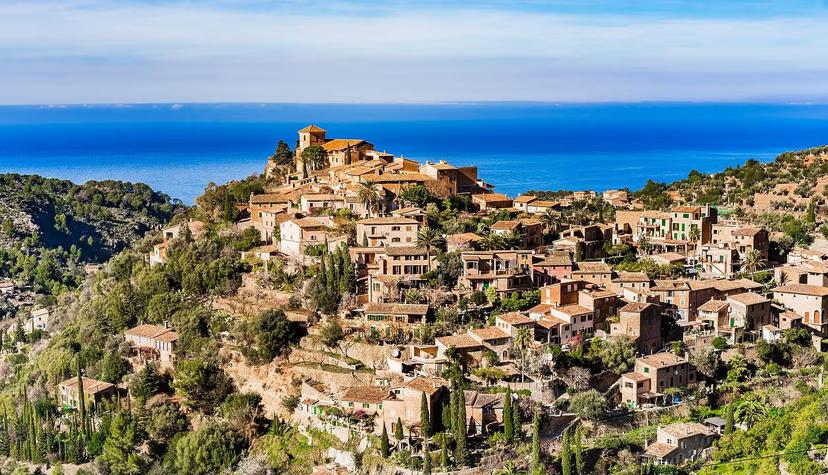 Looking over Deià's honey-coloured houses, which occupy a stunning mountain-top location overlooking the Mediterranean.