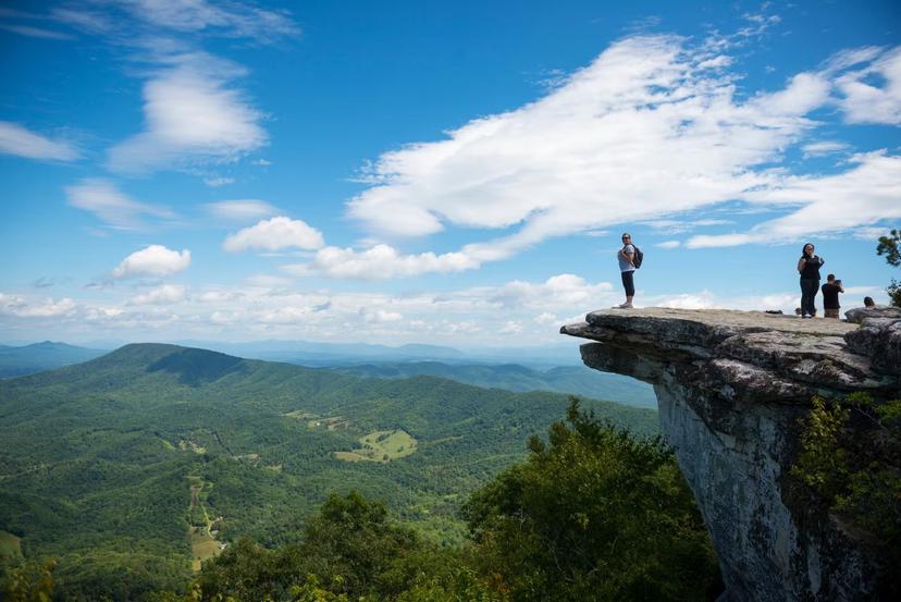 Hikers take in the view of the Appalachian Mountains from McAfee Knob on Catawba Mountain © Joel Carillet/Getty Images