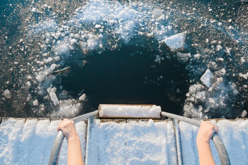 Getting ready for an invigorating dip in an ice hole © iStock / Getty Images Plus