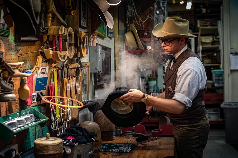 Apprentice Austin Kitchens is learning the millinery trade at just a few years older than Jack Kellogg was when he got started making hats © Laura Watilo Blake / Lonely Planet